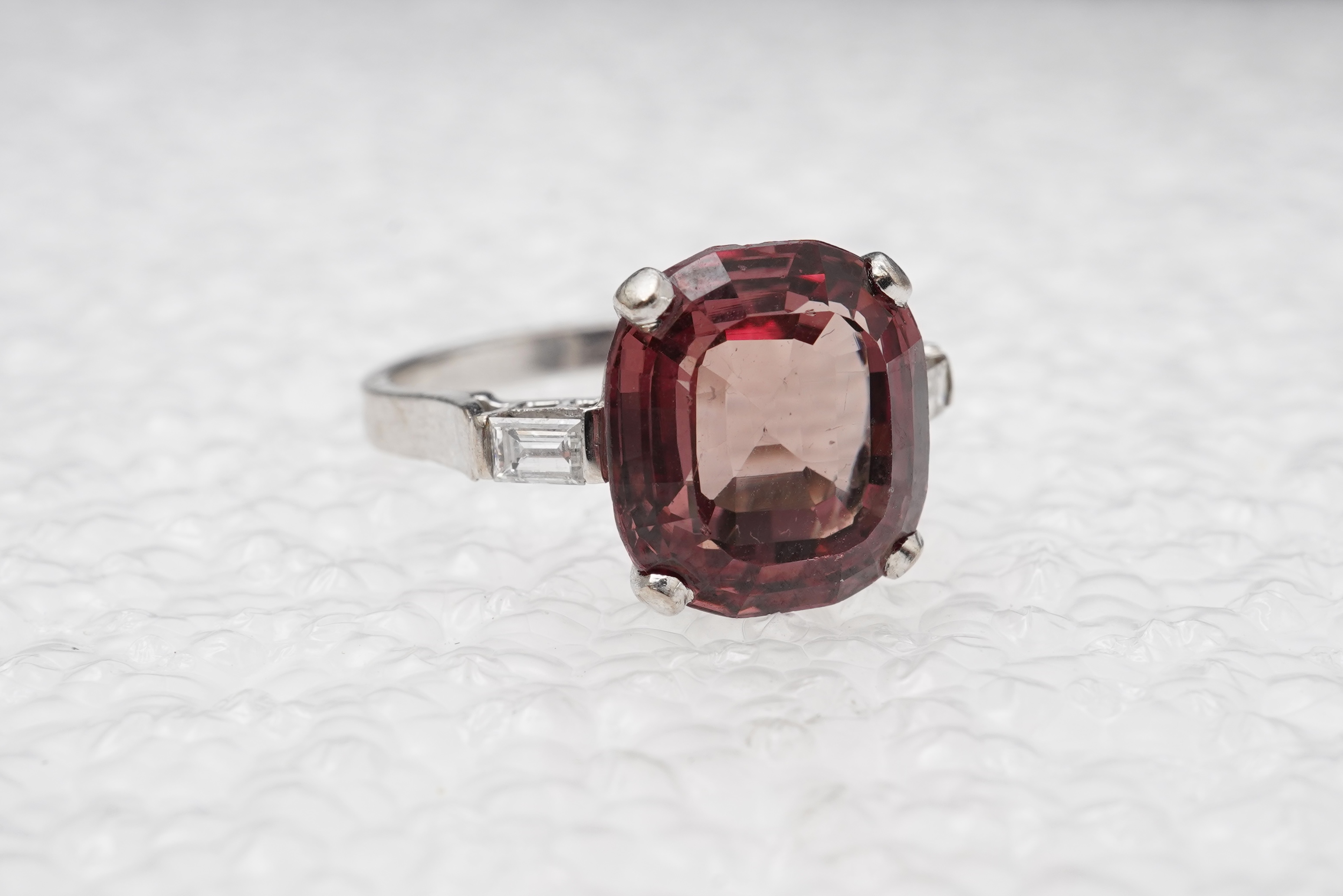 A garnet and diamond ring
